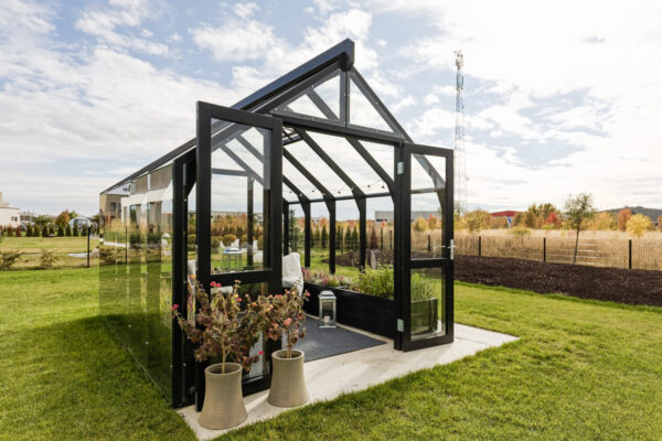 Wooden greenhouse painted black